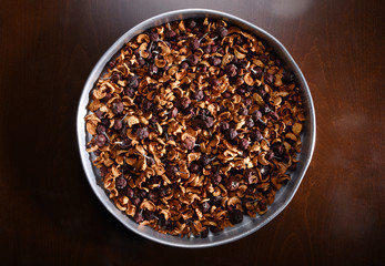 Directly above mixed dried fruits in a tray