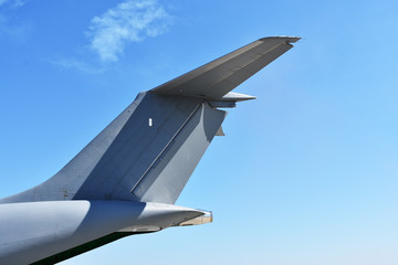 Fototapeta na wymiar Airplane tail with sky background