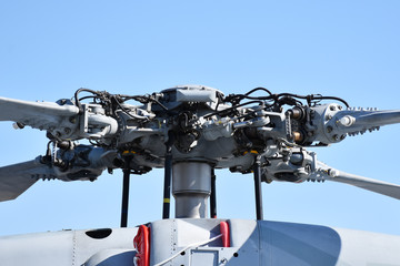 Close-up helicopter rotors with clear sky background