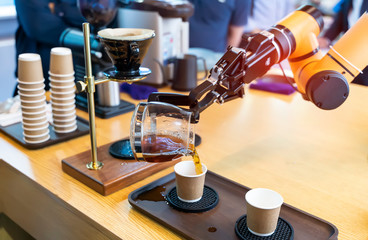 robotic arm preparing coffee in coffee machine