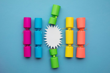 Bright festive christmas crackers on a blue background
