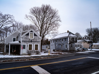 Houses Line Railroad Tracks at a Crossing