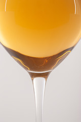 Glass of white wine on a white background and with soft shadow. There is a place for text.