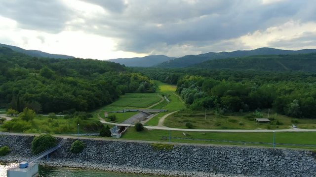 Lake Butoniga Croatia aerial view of water canal tributary and retaining wall, drone flyover shot