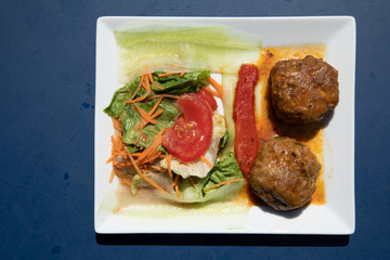 Delicious spanish tapa dish with meatballs and salad cucumber tomato paprika tapas spain food
