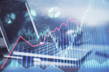 Forex market chart hologram and personal computer background. Double exposure. Concept of investment.