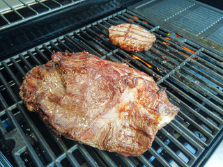 Grilling a piece of beef meat with friends on a bbq party grill delicioous fine food  barbecuing barbeque barbequing season seasonal super tasty