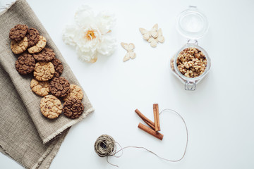 Obraz na płótnie Canvas Homemade oatmeal cookies with cinnamon on white background . Healthy Food Snack Concept.