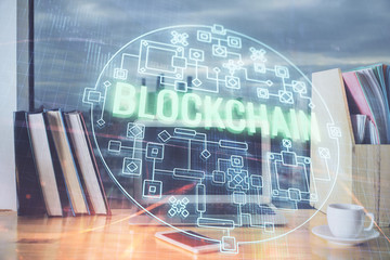 Double exposure of blockchain theme hologram and table with computer background. Concept of bitcoin...