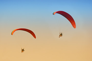 Paramotor flying on sky