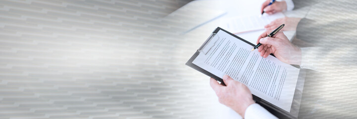 Businesspeople taking notes; panoramic banner
