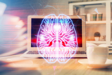 Obraz premium Double exposure of table with computer and brain hologram. Data innovation concept.