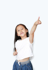 Portrait of happy little child girl poiting up and looking at camera isolated over white background.