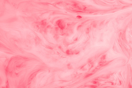 A Macro Photo Of Drops Of Red Food Dye Swirled And Mixed Into Thick Creamy White Milk To Give A Marbled Milkshake Effect