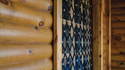 wooden house and wrought iron bars on the window