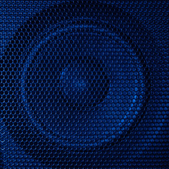 A close up macro photo of a speaker lit with a vibrant blue flash gel
