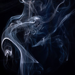 A close up macro photo of incense smoke lit by a blue flash to create a moody glow overlay with a square crop