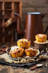 Fresh homemade delicious apple and carrot muffins with dried fruits and nuts
