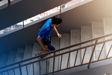 Sportsman runner running up on the steps stairs