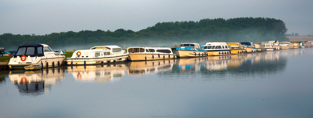 Boats at dawn, Norfolk Broads, England