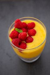 Chia pudding and Mango smoothie with raspberry topping