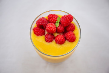 Chia pudding and Mango smoothie with raspberry topping