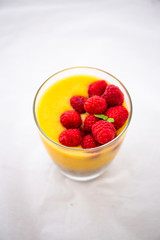 Chia pudding and Mango smoothie with raspberry topping