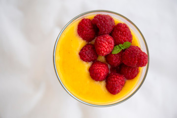 Chia pudding and Mango smoothie with raspberry topping
