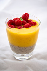 Chia pudding and Mango smoothie with raspberry topping