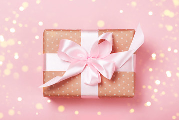 Fototapeta premium Luxurious gift on a trendy pink colors. Present for St. Valentine's day, weddings, engagements, Mother's Day, birthday, New Year, Christmas, holidays