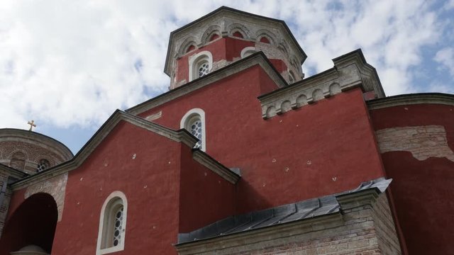 Cloudy sky above orthodox Zica monastery dome 4K panning footage
