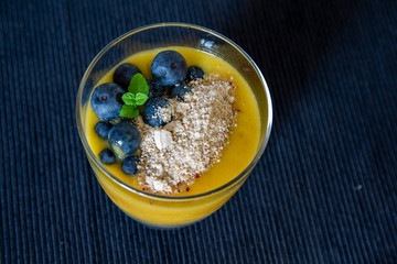 Chia pudding and Mango smoothie with blueberry amd granola topping
