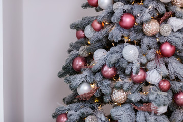 Beautiful Christmas tree decorated with toys and gift boxes