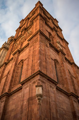 Red stone tower of a church