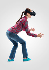 Woman wearing VR headset and gesturing in air