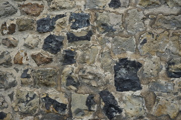 The texture of gray and black stone. Macro rock background