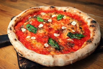 Freshly baked pizza on a wooden table