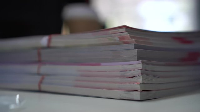 stacks of document book or paperwork on table about accounting planning budget in offices, arranging documents of financial folder at business workplace. 4k