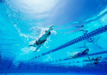 Female swimmers swimming in pool