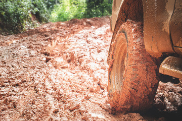 Off-road tires, Dirty offroad car, SUV covered with mud on countryside road.  offroad travel  and...