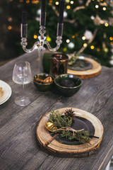 Christmas table setting. Holiday Decorations. Rustic table setting for Christmas eve