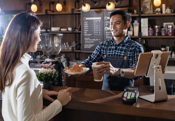 Barista serving coffee cup