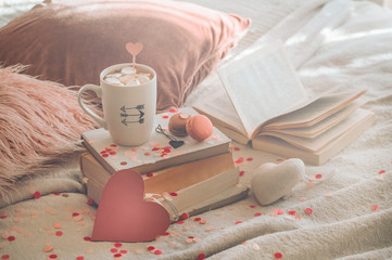 Happy Valentines Day postcard. Love concept for mothers day and valentines day. Hearts and the books with cup coffee