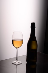 still life of wine bottle glass studio shooting