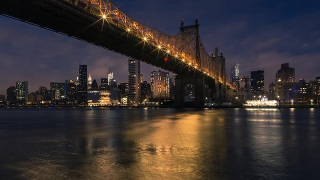 Night to day time-lapse Queensboro bridge and Midtown Manhattan From East river
