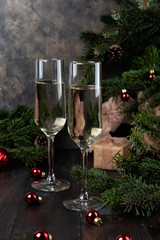 Christmas glasses of champagne and fir tree branches