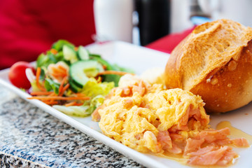 Fresh Salmon with lemon and bread - A seafood salad with smoked salmon.Bacon and Fries with seafood salad