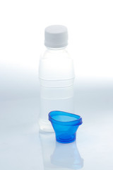 Bottle of eye solution with cup