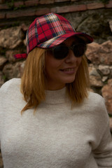 blond woman with plaid cap