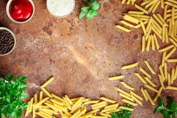 penne pasta and sauce (set of ingredients) menu concept. top food background. copy space